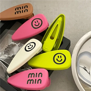Matte rubber finish alloy hair clips with smiley face and min min text patterns