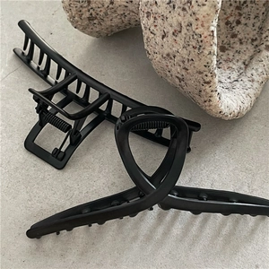 Minimalist matte black alloy hair claws in hollow rectangular and twisted cross designs