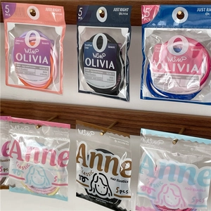 Five-piece colorful seamless hair elastics set in Olivia and Anne classic packaging
