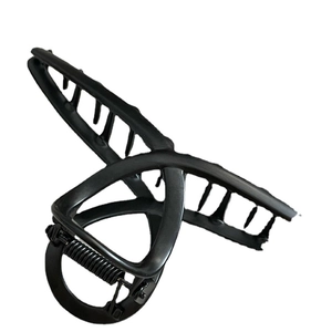 Minimalist matte black metal claw clip with a crossover design for elegant hair styling