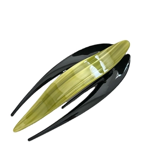 Elegant large leaf-shaped acetate hair claw clip in shimmering yellow-green and black