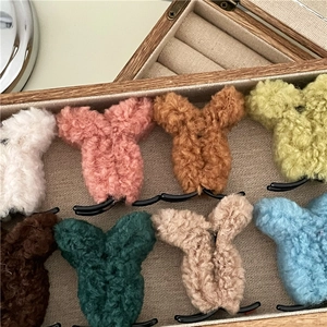 Plush lamb wool hair clips in various colors for high ponytail styling and winter fashion