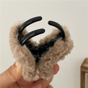 Detail of brown plush claw clip with soft faux fur and durable inner plastic base