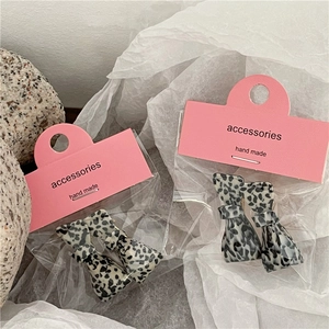 Cute leopard print acetate bow hair clips set on pink handmade display card packaging