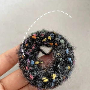 Close-up of fuzzy doughnut hair scrunchie with colorful plush texture and high elasticity