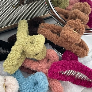 Chic 13cm oversized plush claw clips in various winter colors for elegant hair styling