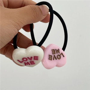 Pink and white heart hair ties featuring LOVE ME letter charms for girls ponytail