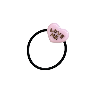 Sweet pink resin heart hair tie with LOVE ME text on black elastic band for girls