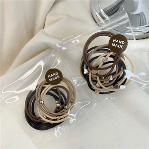 Set di 10 elastici per capelli minimalisti con strass a cuore e perline dorate
