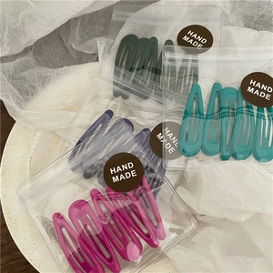Set di 5 fermagli per capelli BB a goccia in colori pastello su vassoio ceramico