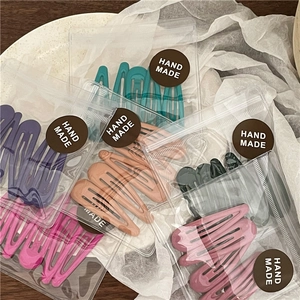 Set di 5 fermagli per capelli a goccia in colori Morandi con finitura opaca e etichette