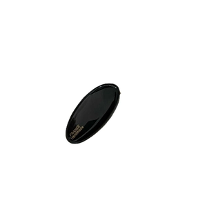 French style handmade black oval hair clip with gold lettering on a white background