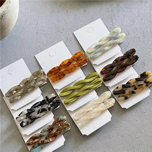 Romantic twisted acetate hair clips in various marble and tortoiseshell patterns