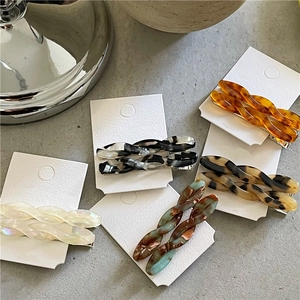 Elegant acetate twist braided hair clips in five colors including pearl and amber