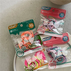 Detail of 35pcs colorful kids hair ties in transparent bag with MSMP branding