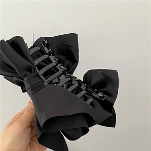 Elegant black satin bow hair claw clip for women featuring a vintage French style design