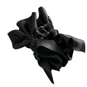 Elegant black satin fabric bow hair claw clip for women's sophisticated hair styling