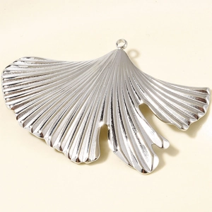 Detailed macro view of 304 stainless steel ginkgo leaf pendant with realistic vein texture