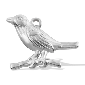 Macro shot of a silver bird charm on a branch with detailed feather texture and bail