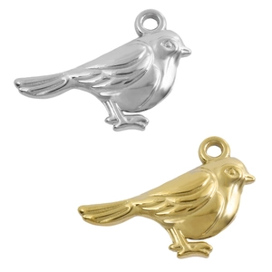 Detailed view of 18k gold and silver bird pendants with feather textures for DIY jewelry