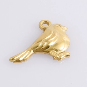 Detailed macro view of gold plated bird pendant with intricate feather textures and top ring