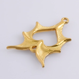 Macro detail of a golden bat wing star pendant made of 304 stainless steel for DIY jewelry