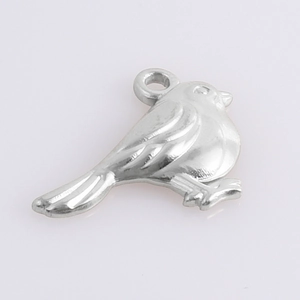 Detailed macro view of a 304 stainless steel bird pendant with a polished silver finish