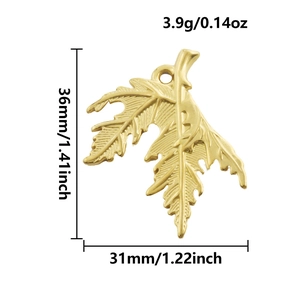 Detail view of 18k gold plated leaf pendant with precise 36mm x 31mm size dimensions