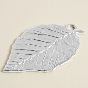 Detailed view of silver leaf pendant showing fine plant vein texture on 304 stainless steel