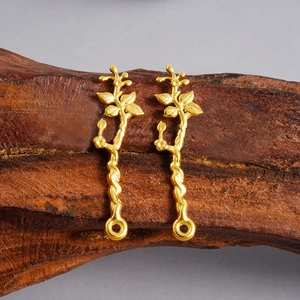 Macro shot of 304 stainless steel golden flower branch pendants for DIY jewelry crafting