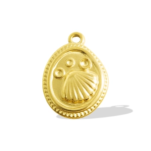 Detail macro view of 18k gold plated scallop shell pendant with beaded texture and loop