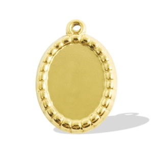 Detailed view of oval stainless steel pendant with beaded edge and gold finish