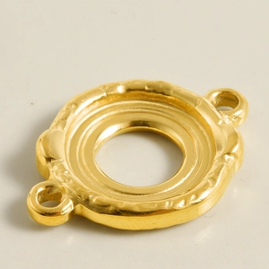 Close-up of golden hammered stainless steel circular connector with dual hanging loops