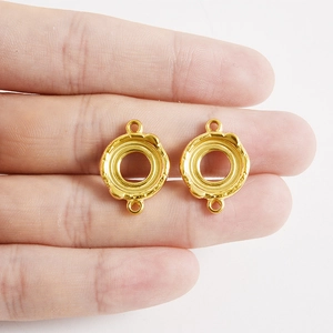18K gold plated stainless steel circular lava pendants for jewelry making held in hand