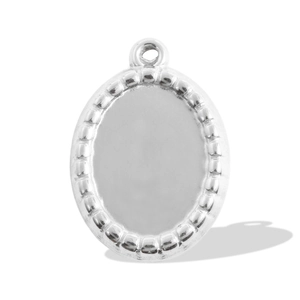 Close-up of oval stainless steel bezel pendant with beaded edge and polished flat center