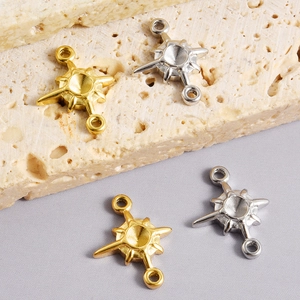 Detailed macro view of 18K gold and silver star connectors for necklace making