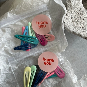 Lot de 10 barrettes à cheveux macarons de couleur crème dans un sac transparent