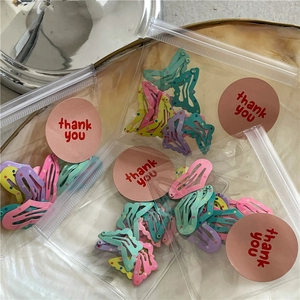 Pastel macaron color wavy and star shaped hair clips in decorative gift packaging