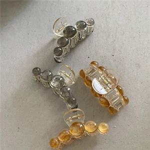 Pinces à cheveux géométriques effet gelée en ambre et gris fumé transparent