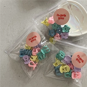10-piece set of mini macaron flower hair clips in various jelly colors and packaging