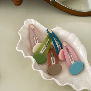 Colorful jelly texture oval hair clips set in a decorative white shell porcelain plate