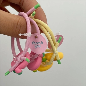 Cute fruit-themed hair tie set with strawberry and cherry resin charms for girls