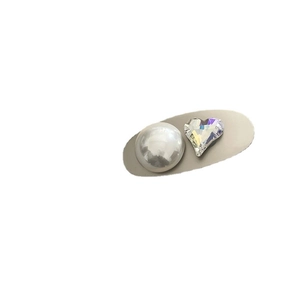 Minimalist silver hair clip with large faux mabe pearl and faceted crystal heart detail