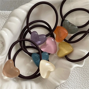 Macaron color heart hair ties set on white shell plate with high elastic black bands