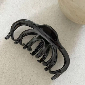 Polished black large octopus hair claw clip with cross-teeth design for thick hair