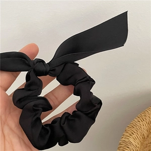 Elegant black satin hair scrunchie with long ribbon bow for women hair styling