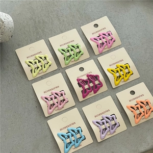 Set of 18 butterfly hair clips in assorted macaron colors on display cards