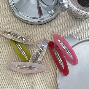 Set di cinque fermagli per capelli ovali in acetato con motivi marmorizzati e floreali