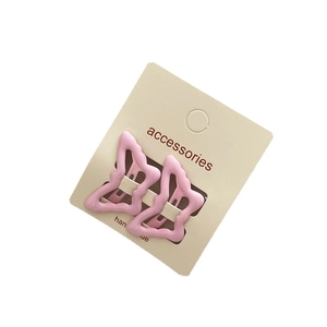 Set of two cute pink butterfly hair clips with matte finish on a display card