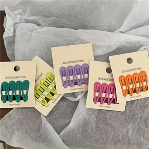 Set of colorful matte lacquer mini teardrop snap hair clips in five vibrant shades